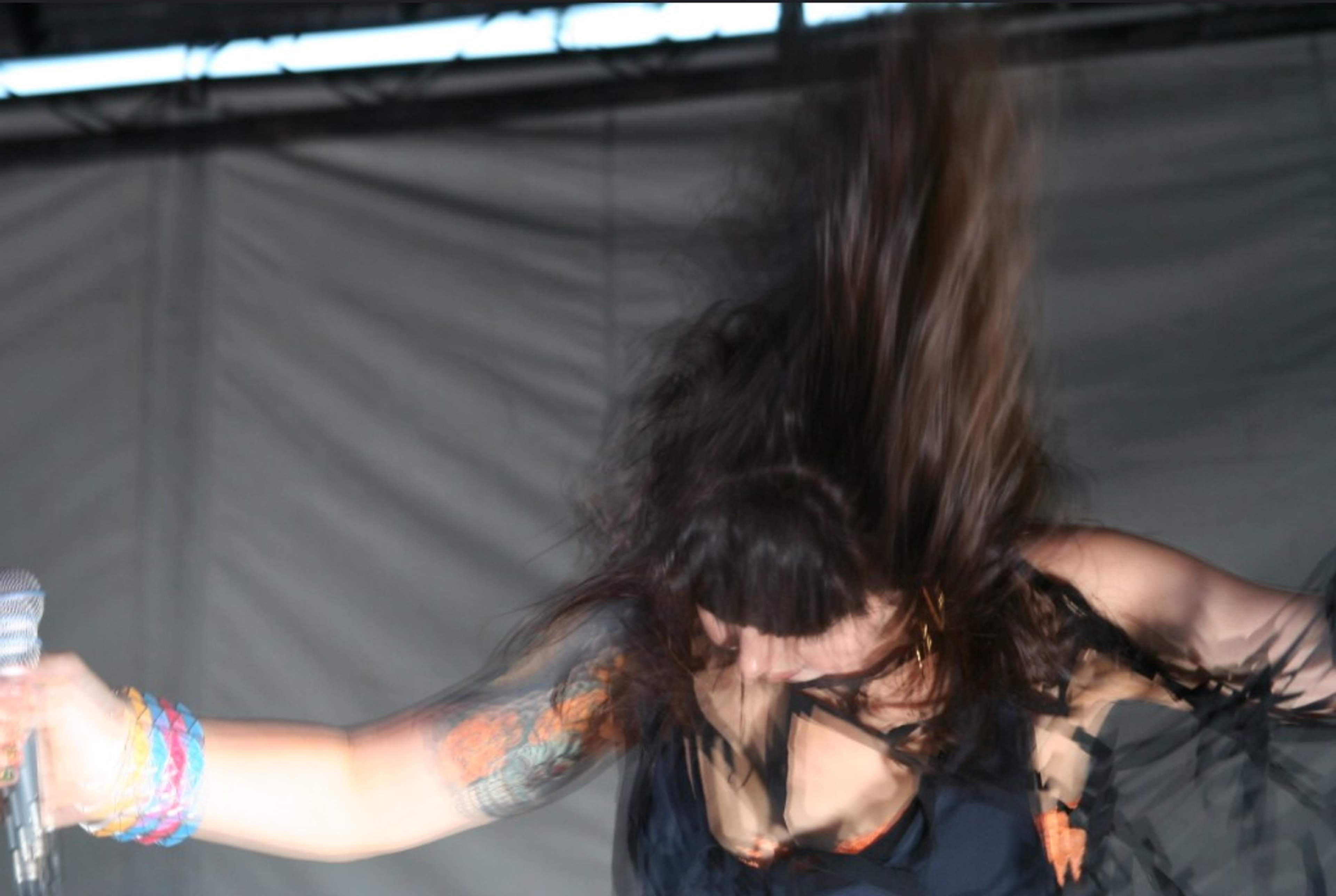 Alexis Kraus of Sleigh Bells head banging, action shot at Pitchfork Music Festival 2012. 