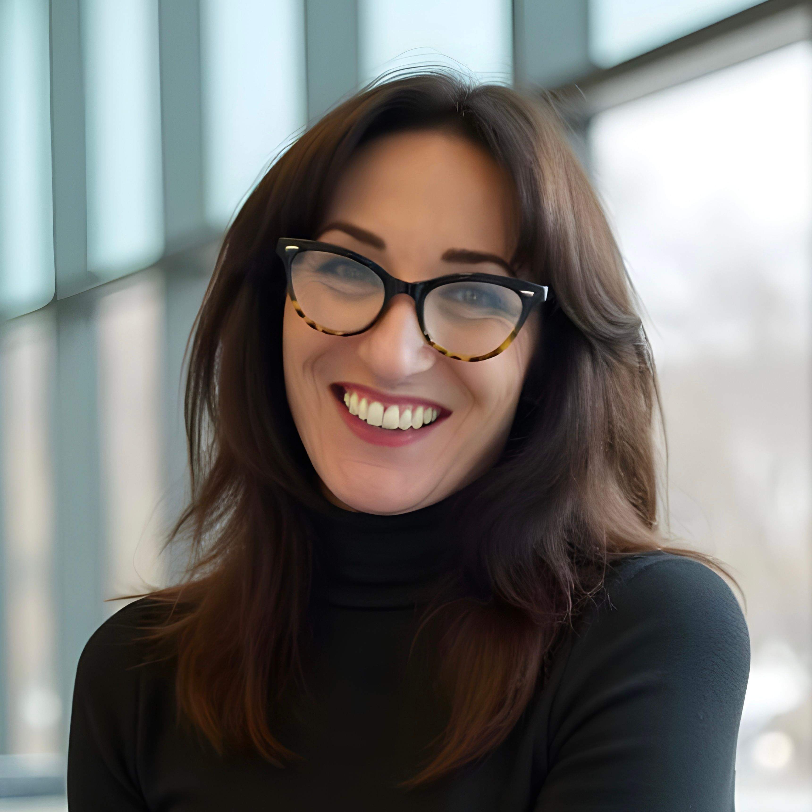 Headshot of Brenna Hamilton, modern brand leader delivering up to 800% growth.