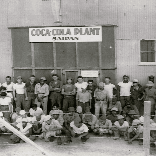 The staff of the Coca-Cola bottling plant established in Saipan. National WWII Museum.