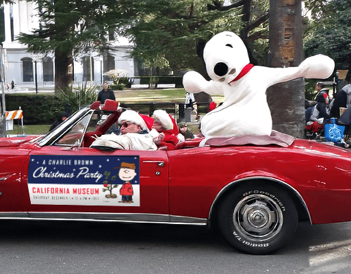 Image of Snoopy as the Sacramento Santa Parade's Grand Marshal from an event activation for Pigskin Peanuts by Brenna Hamilton.