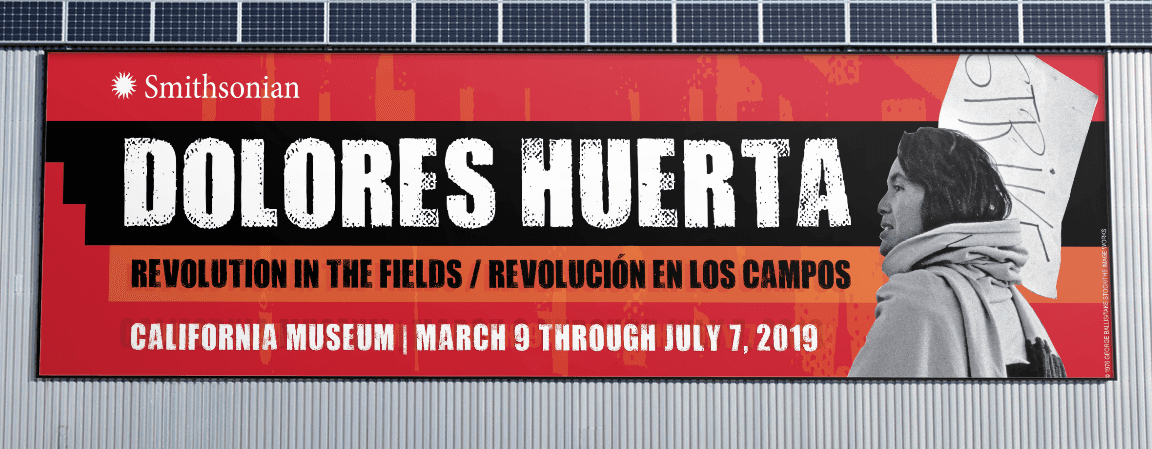 Image of a billboard promoting "Dolores Huerta" exhibit from a bilingual brand system by Brenna Hamilton.