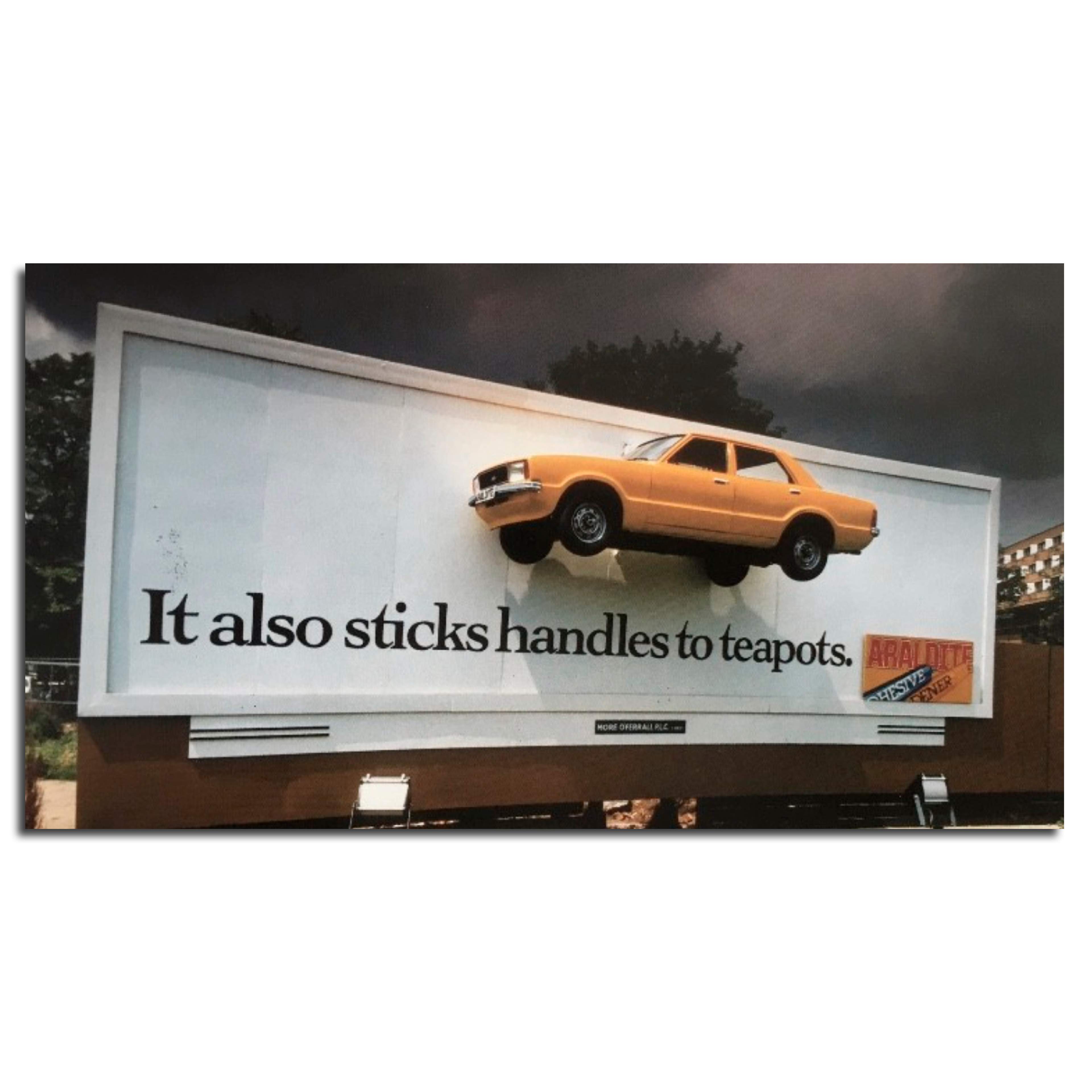 A car is stuck to a 48-sheet poster with Araldite. Award-winning poster. 