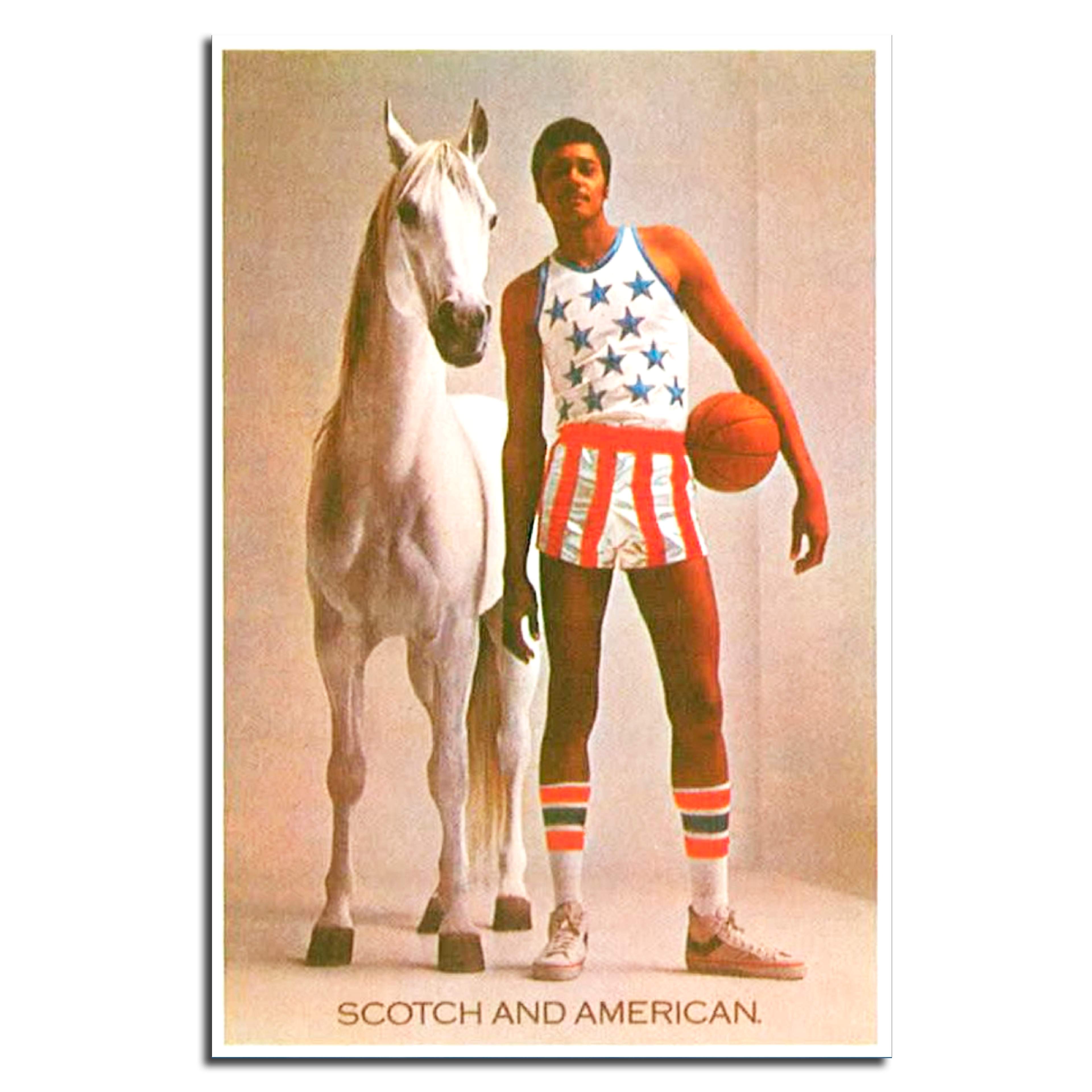 Colour photograph of a white horse with a tall American basketball player. Award-winning White Horse Whisky press ad.