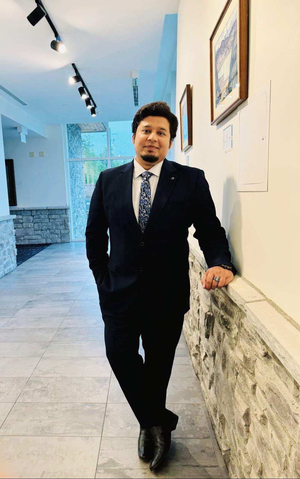An image of the author, a content strategist, in formal suits.