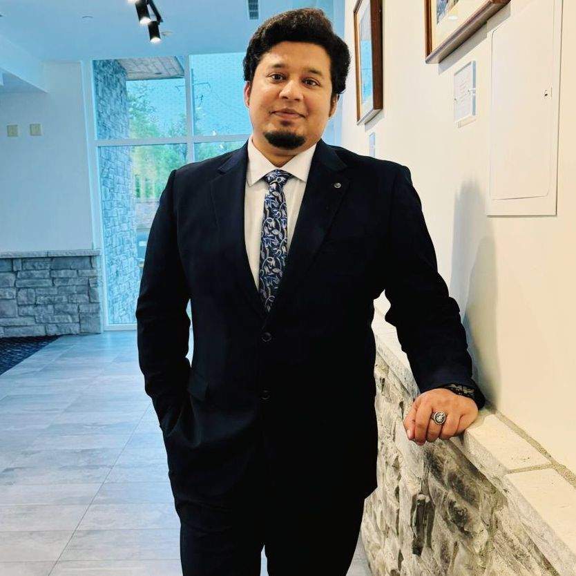 An image of the author, a content strategist, in formal suits.