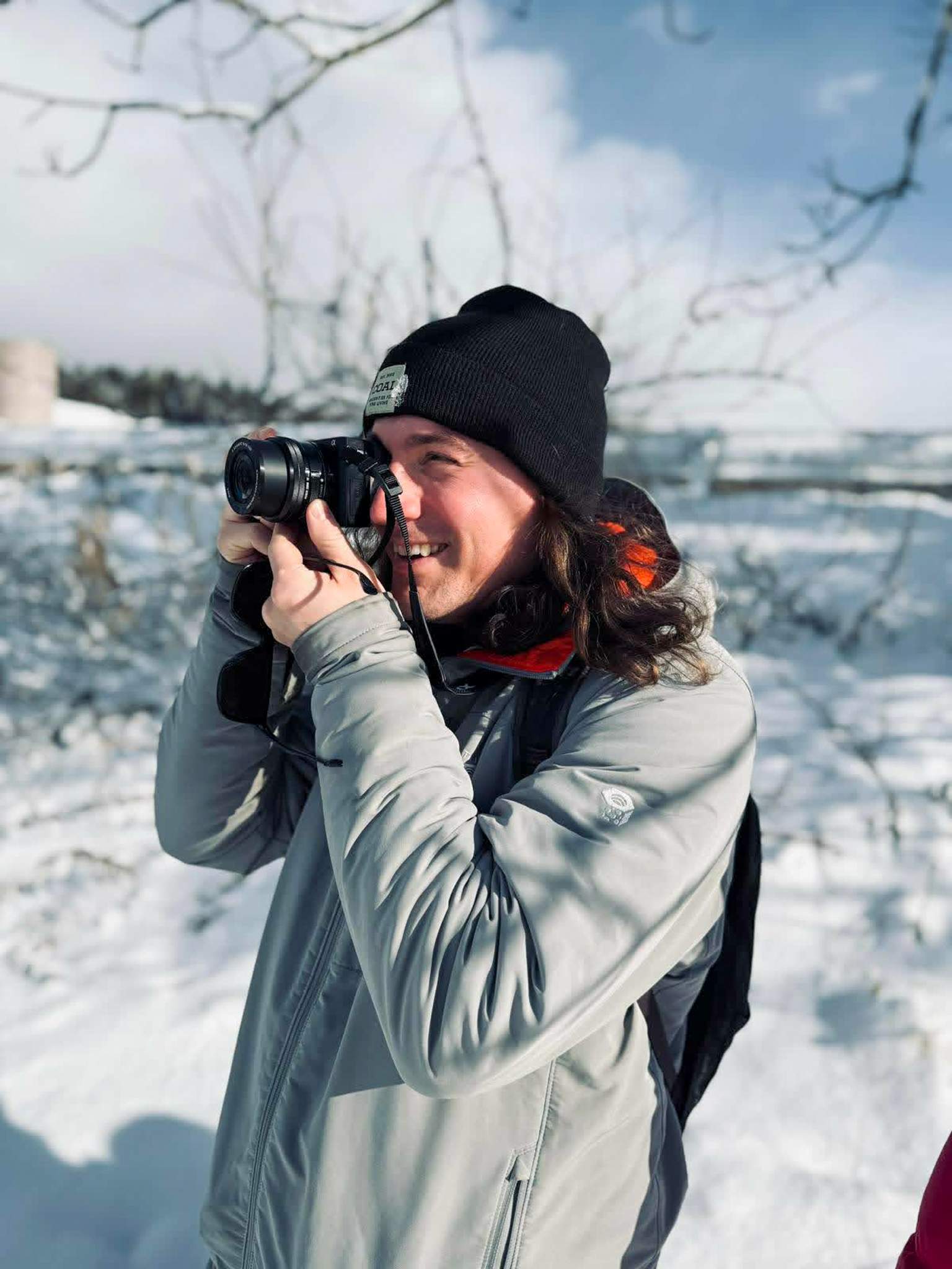 Travel writer taking a photo near Lake Tazawa in Akita Prefecture, Japan.