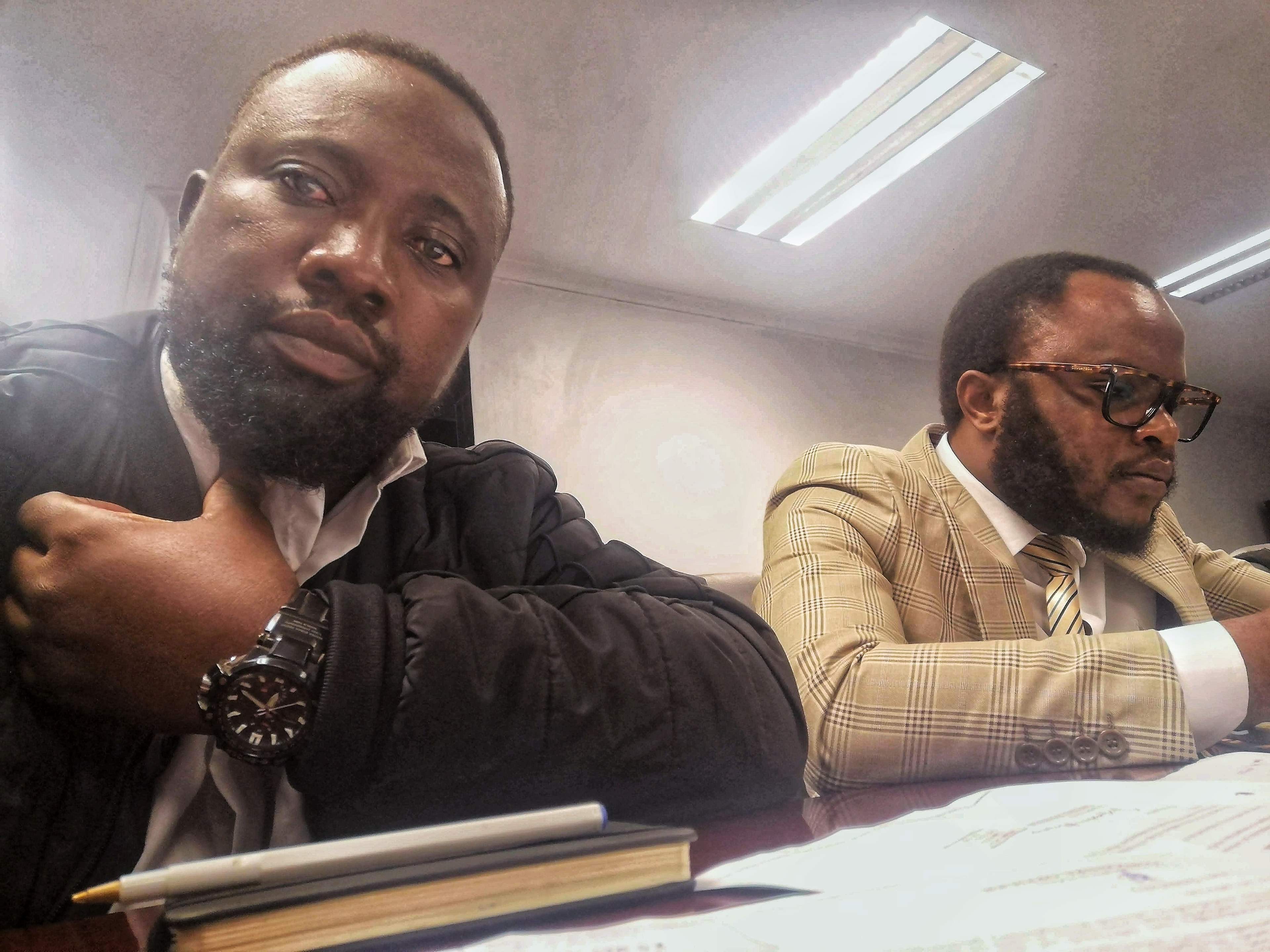 Thabang Manhika with his lawyer at the Zimbabwe Media Commission.