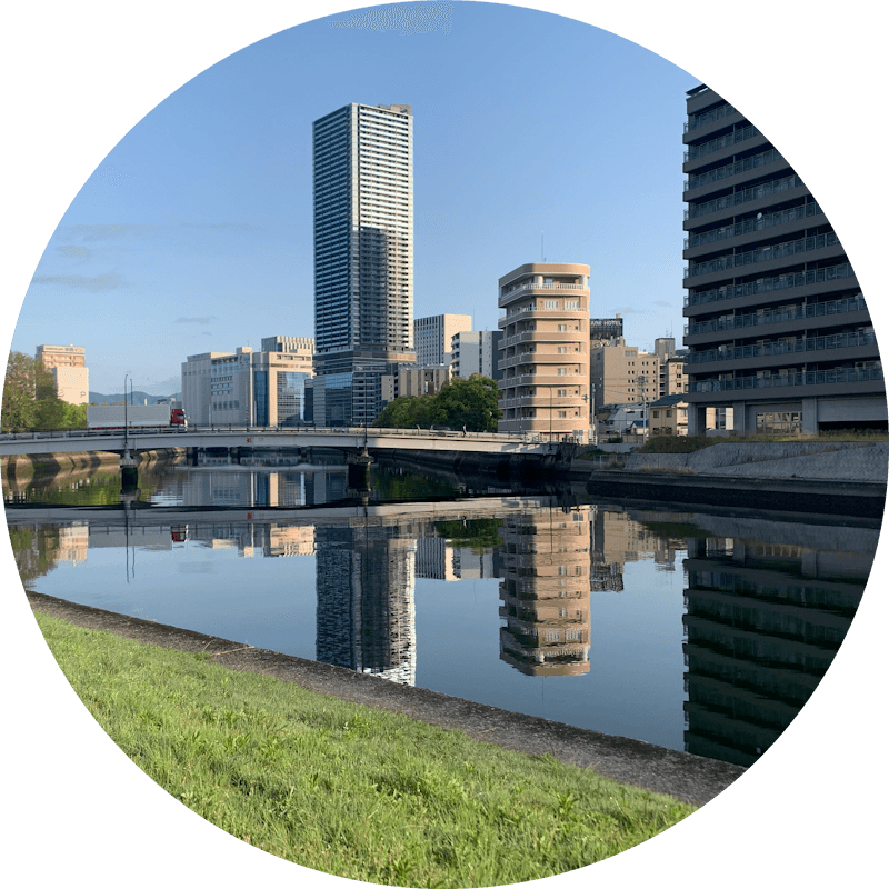 Buildings and bridges reflect on the surface of a river, Hiroshima, Japan.