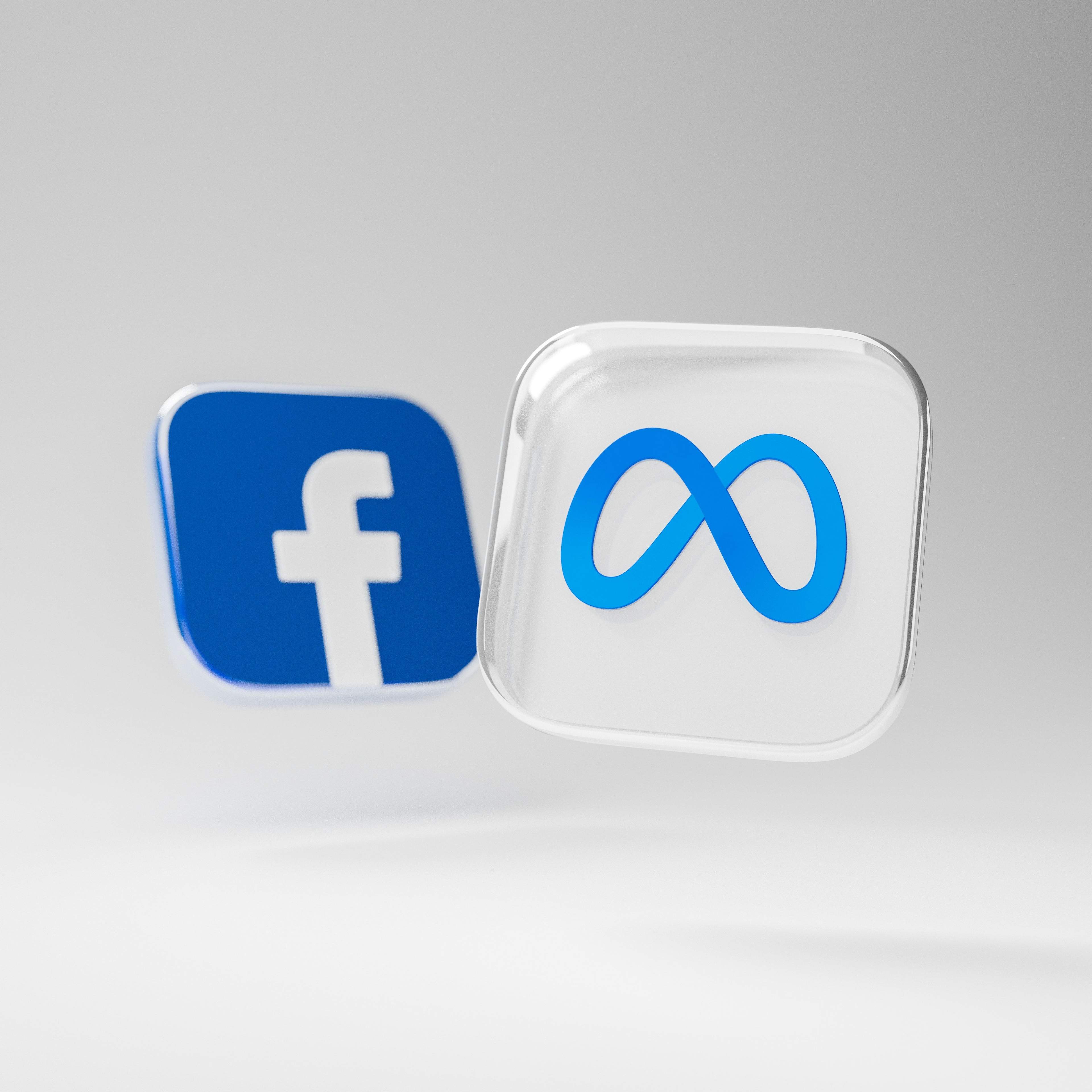 Facebook and Meta emblems.
