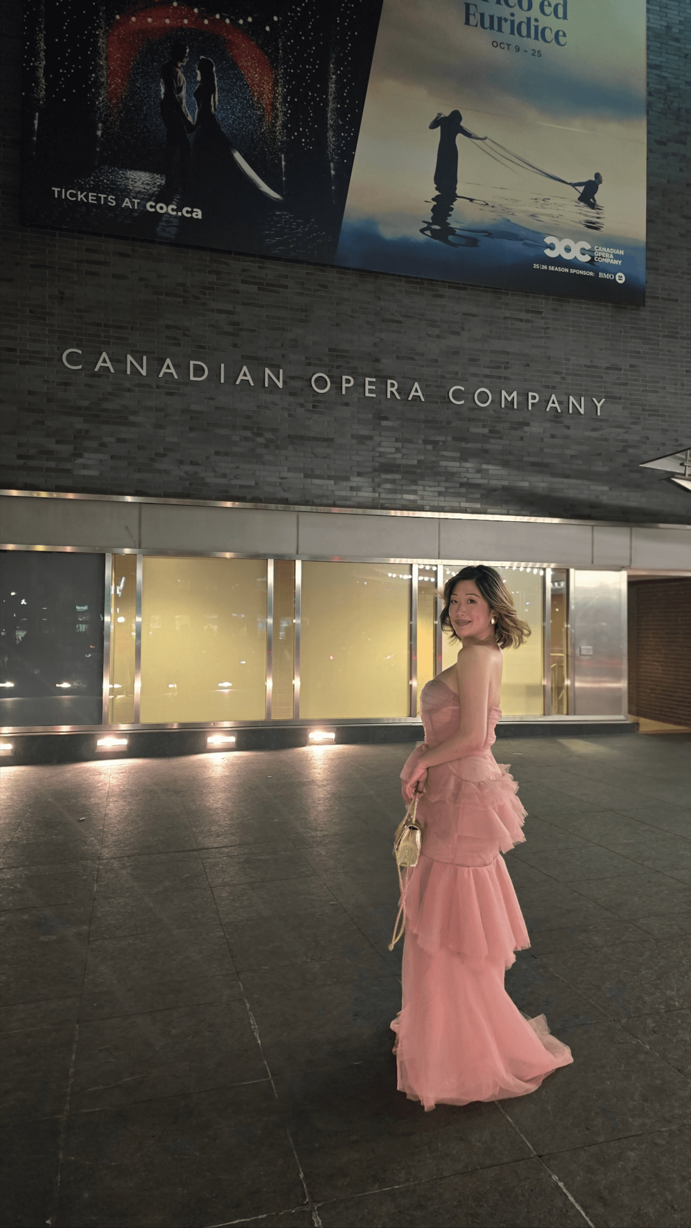Woman in a tulle pink gown standing outside Four Seasons Centre for Performing Arts with Canadian Opera Company Roméo et Juliette