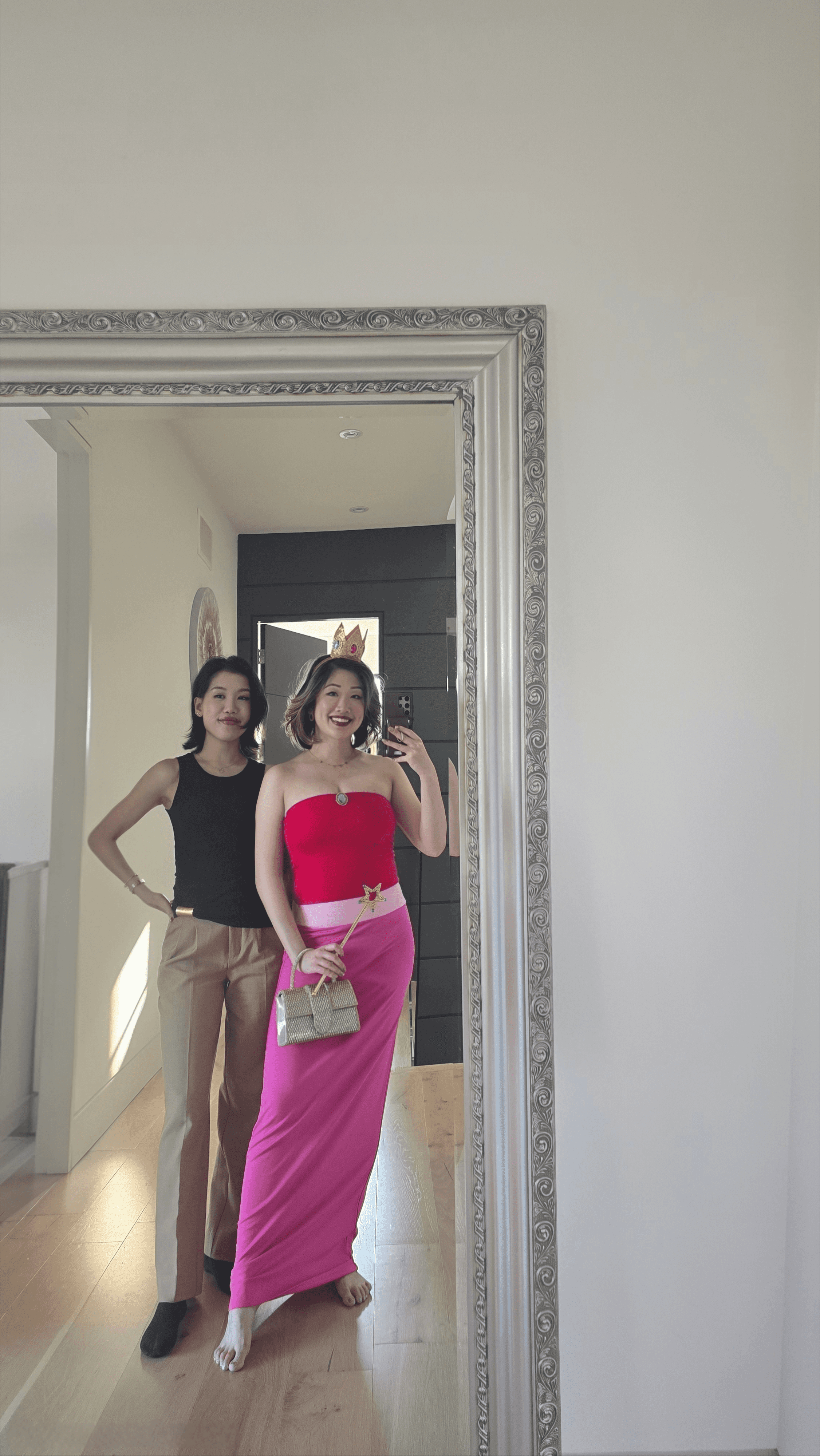 Betty Lam, dressed as a modern Princess Peach, takes a mirror selfie with a friend before a themed birthday party.