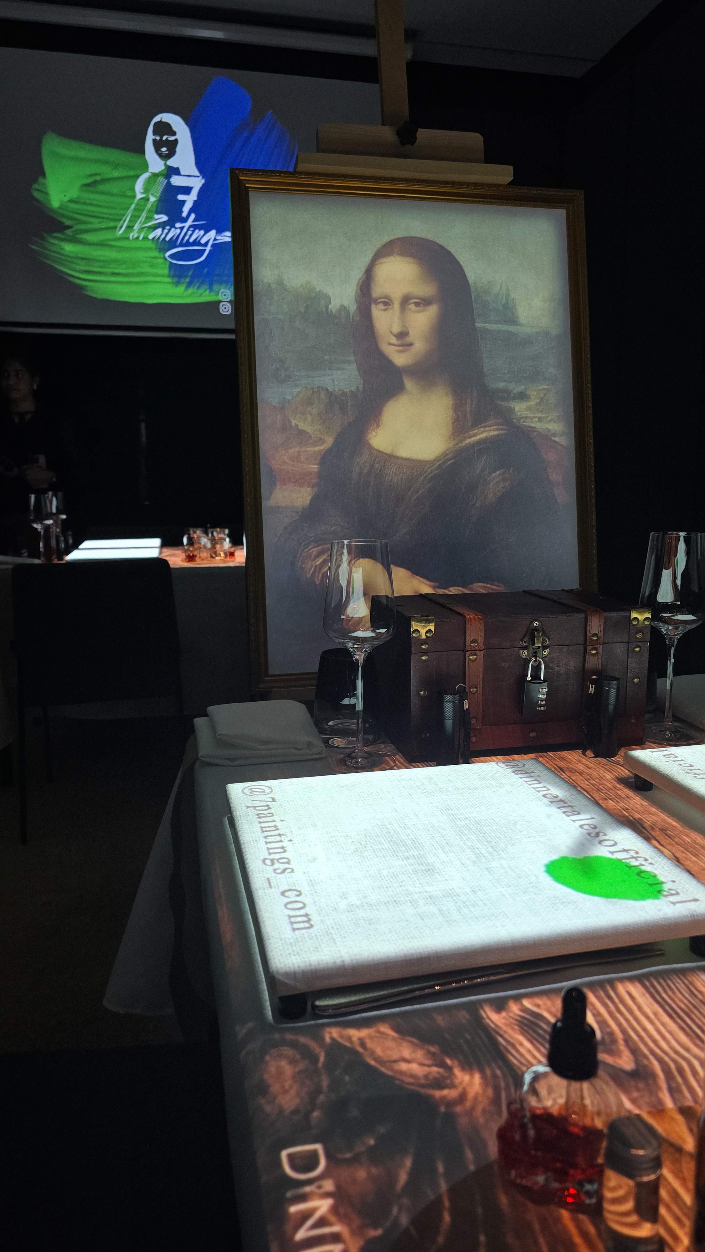The art-filled ambiance at 7 Paintings Toronto, showing the Mona Lisa and an interactive menu book at Canopy Hilton