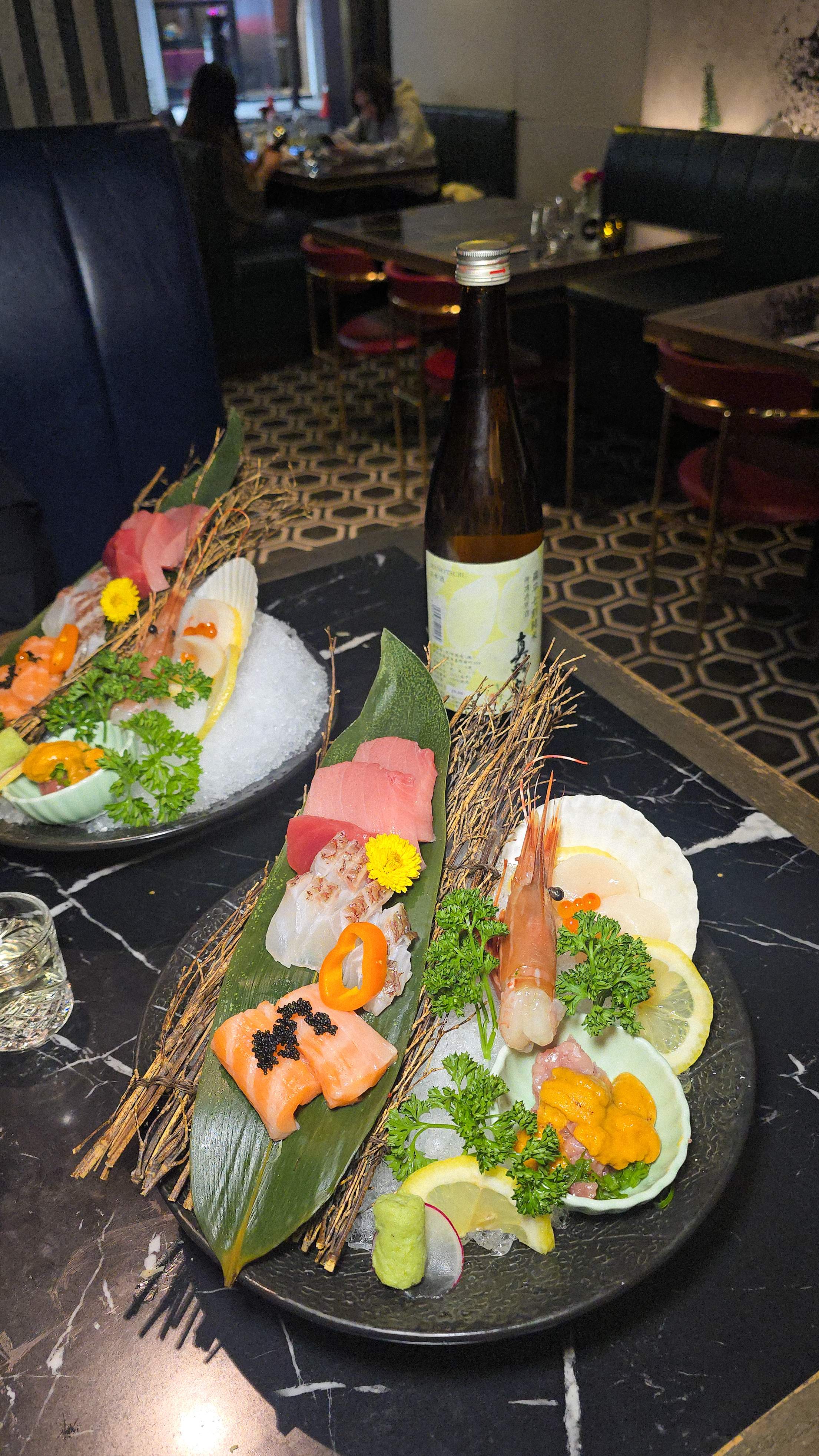 Fresh seasonal sashimi platter featuring Scallop, Salmon, and Hamachi. Part of the 12-course Holiday Tasting Menu and Sake Pairing at Flame 