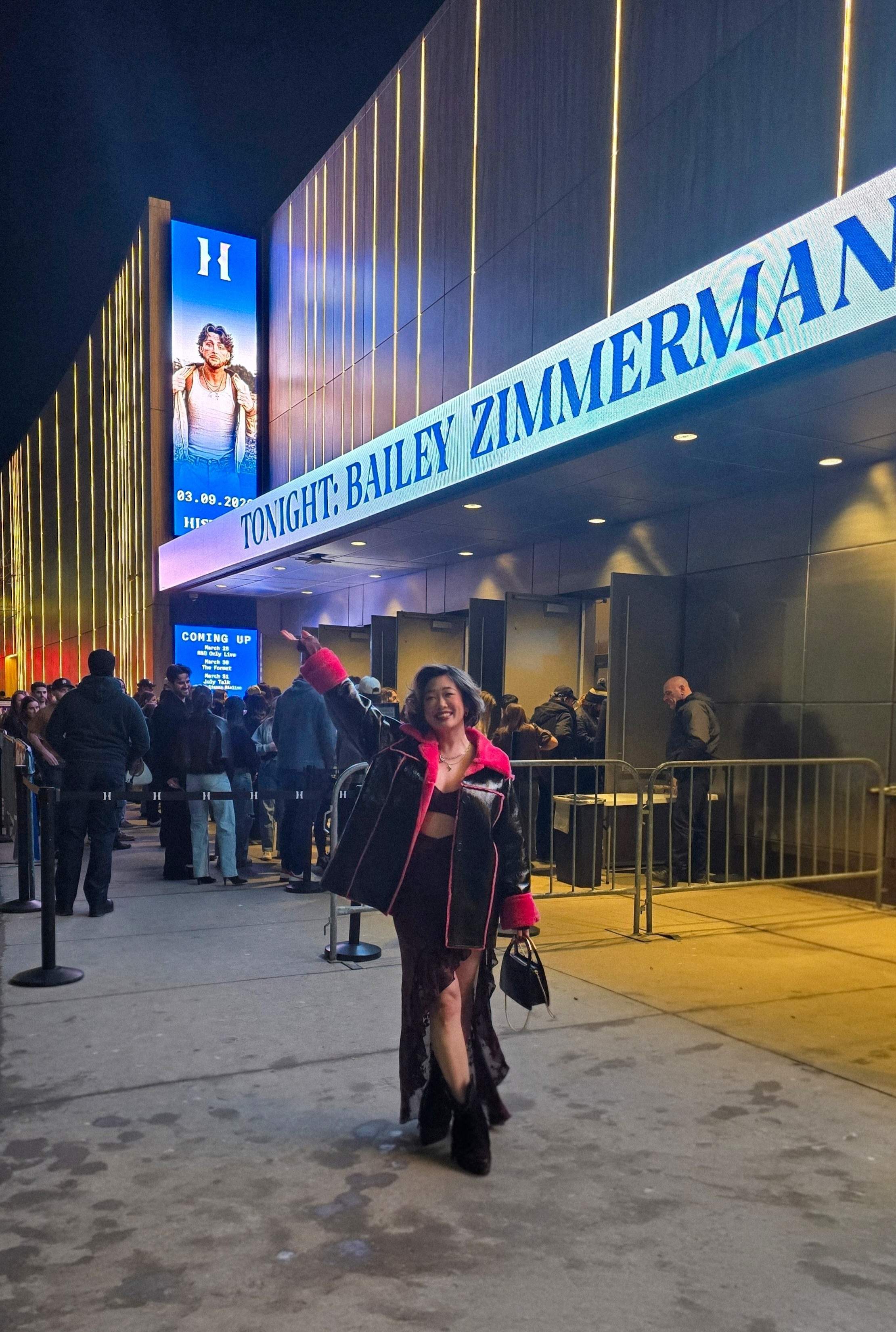 Fun country glam outfit! Pointing at the Bailey Zimmerman tour marquee outside HISTORY Toronto, skipping the massive general line. ✨