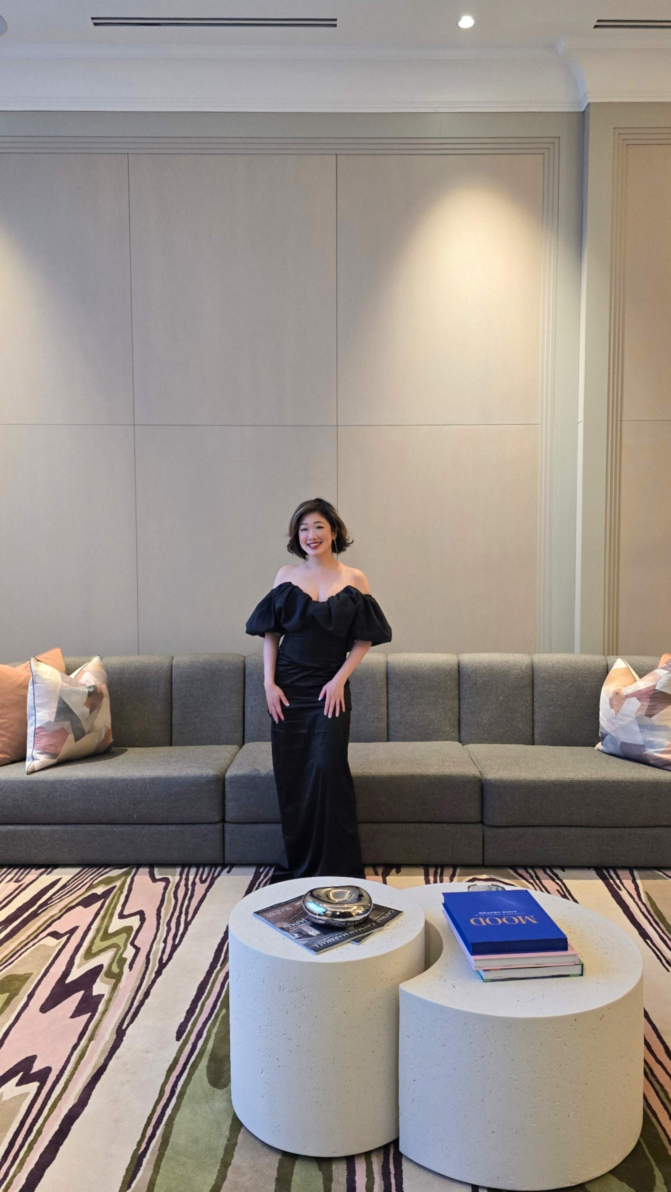 Betty Lam in the elegant resident lounge at Edenbridge condos in Toronto. Modern luxury interior design by II BY IV DESIGN.