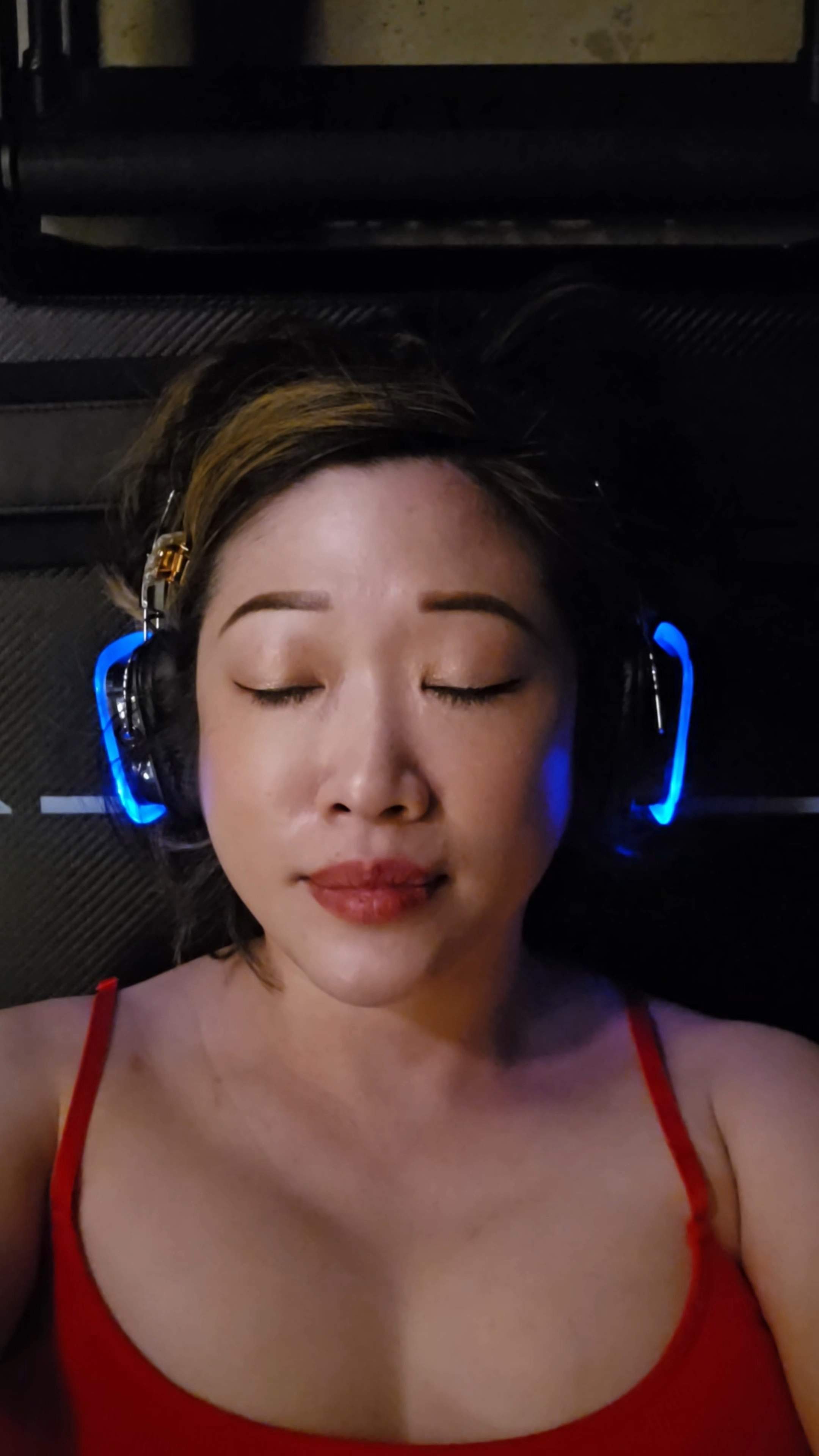 Close up of woman lying on reformer with eyes closed during breathwork block at LSD°R Studios modern Pilates Toronto