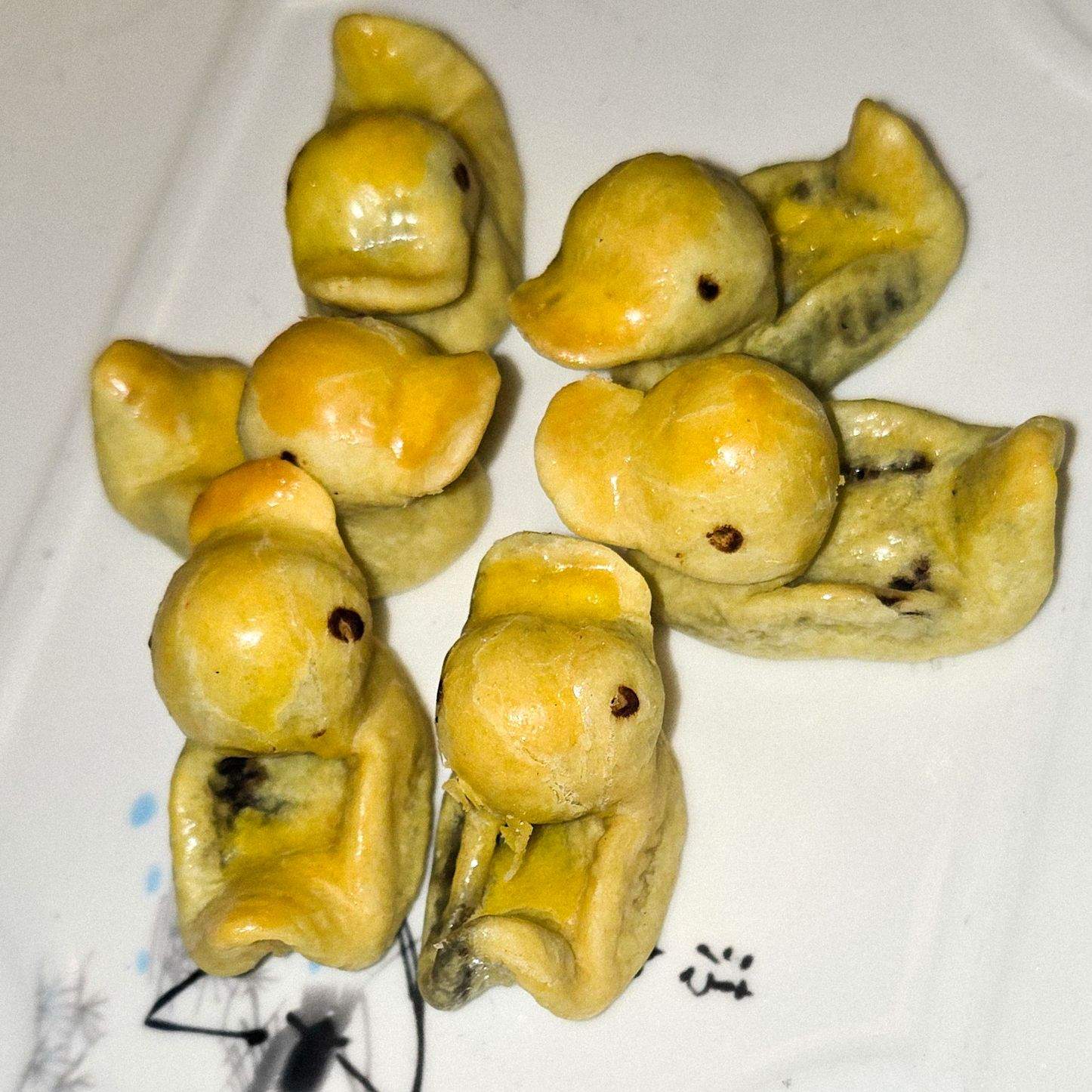 Adorable handmade duckling shaped pastries stuffed with date paste served as dessert at QJD Peking Duck Markham Ontario unique and cute Chin