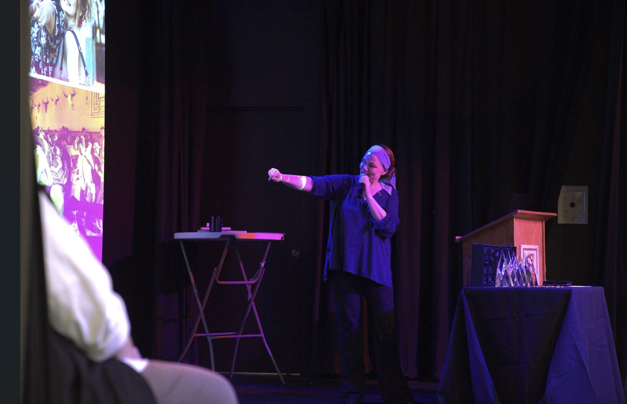 Ellen Maloney, hospitality marketing and communications leader, speaking at an event.