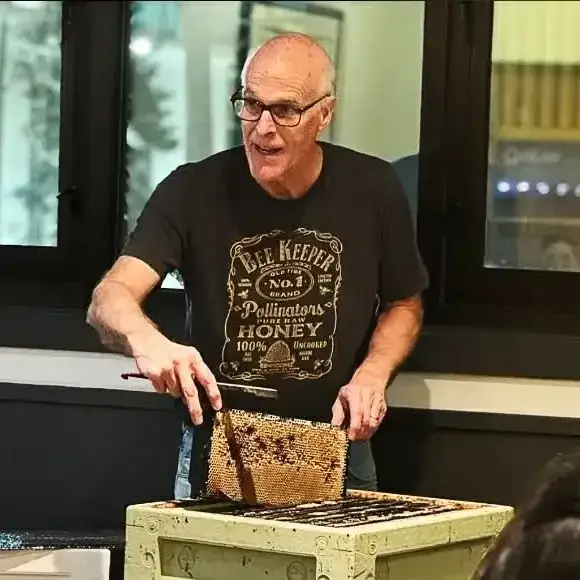 The apiary's beekeeper teaching a class on snowbees at the 49th State Brewing Company.