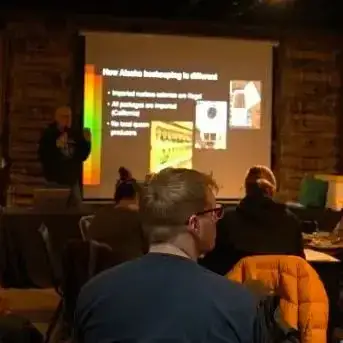 49th State Brewing's beekeeper discussing Snowbees at an apiary conference.